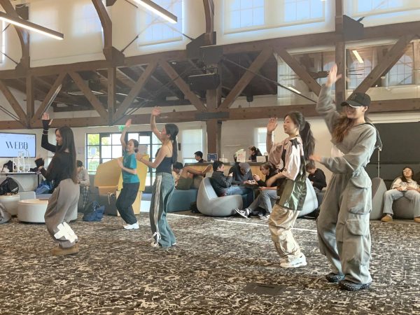 As the holiday season approaches, the Dance Club is hosting a festive K-pop random dance event during lunch at the Stockdale Community Center. “Random dance is when you hear a song that you know the dance to, you come out to the floor and dance. You can jump in and just enjoy the vibe,” said Anna Zeng (‘25), co-president of the Dance Club. The Dance Club sends out song requests and reveals the final list a while before the actual event, so people can practice beforehand if they wish to learn new choreography.  