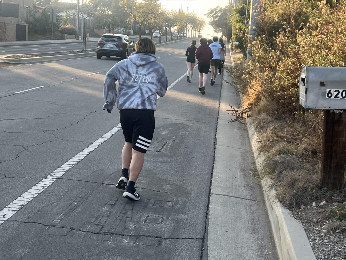 Tyler Liu (‘25), a local day student, runs alongside West Baseline Road. Here, the road is riddled with imperfections and hasty patches, though there may be hope for a solution soon. The City of Claremont began a near $2 million citywide street resurfacing project approved at the May 28 City Council meeting. This project, which will span from Indian Boulevard to Towne Avenue, has locals hoping that this is a precursor to changes across all streets. “I can definitely feel some bumps while driving to school,” Tyler said.  